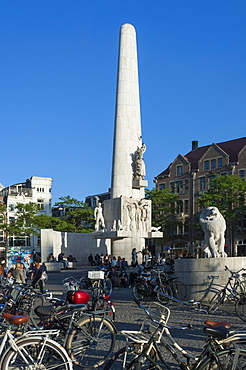 Meeting place around the National Monument in Dam Square, Amsterdam, The Netherlands, Europe