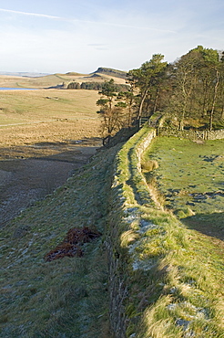 Looking east from wall of Milecastle 37 to Sewingshields Crag and Broomlee Lough, Hadrian's Wall, UNESCO World Heritage Site, Northumbria, England, United Kingdom, Europe