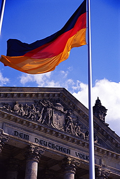 Exterior of the Reichstag Building and flag, Berlin, Germany, Europe