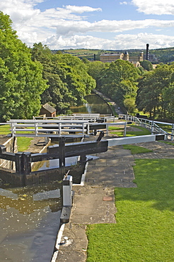 View from the top of the five lock ladder on the Liverpool Leeds canal, including a mill, at Bingley, Yorkshire, England, United Kingdom, Europe