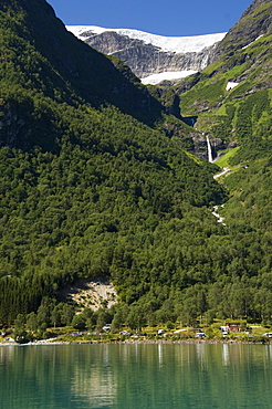 Green lake, waterfall, and glacier above Olden, Fjordland, Norway, Scandinavia, Europe