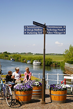 People sitting on a bench at Ribe city center, Jutland, Denmark, Scandinavia, Europe