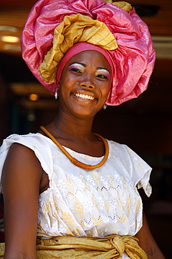 Portrait of a Bahian woman in traditional dress at the Pelourinho district, Salvador (Salvador de Bahia), Bahia, Brazil, South America 