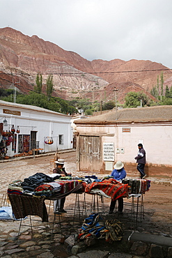 Street scene in Purmamarca with the Mountain of Seven Colors in the background, Purmamarca, Quebrada de Humahuaca, UNESCO World Heritage Site, Jujuy Province, Argentina, South America 