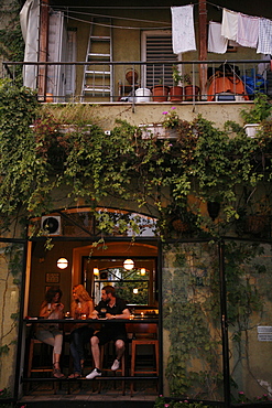 People sitting at a bar in the trendy Neve Tzedek neighbourhood, Tel Aviv, Israel, Middle East