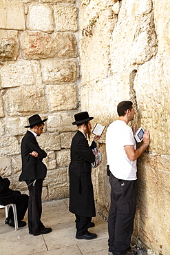 Orthodox Jewish people praying at the Western Wall (Wailing Wall), Jerusalem, Israel, Middle East