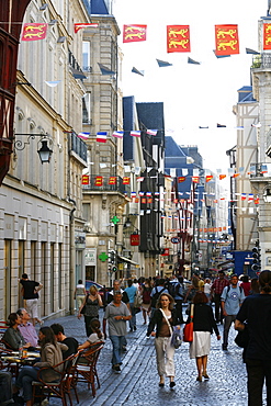 People walking along the Rue du Gros Horloge, the main street of old Rouen, Normandy, France, Europe