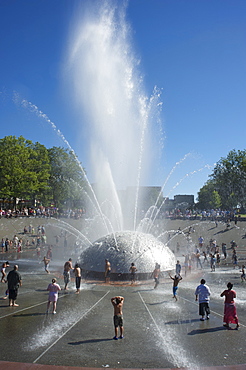 Children play in the Seattle Center Fountain on a hot summer day, Seattle, Washington State, United States of America, North America