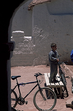 Boy and bike, San Pedro de Atacama, Chile, South America