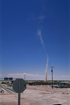 Mini twister (dust devil) forms above town, San Pedro de Atacama, Chile, South America