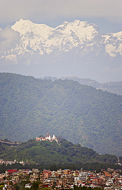 The Buddhist temple of Swayambhu (Swayambhunath) (Monkey Temple), overlooking Kathmandu, UNESCO World Heritage Site, Himalayan mountains beyond, rising to over 6000m, Nepal, Asia