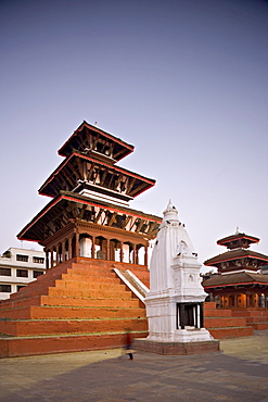 Maju Deval triple roofed Hindu temple with shikara-style Buddhist stupa in front and Narayan temple on far right at dawn, Durbar Square, Kathmandu, UNESCO World Heritage Site, Nepal, Asia