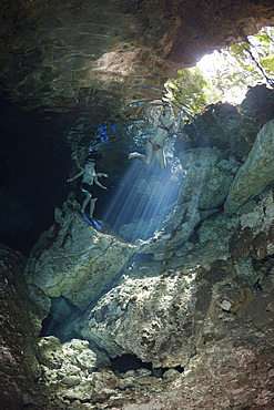 Tourists swimming at Dos Ojos Cenote, Playa del Carmen, Yucatan Peninsula, Mexico