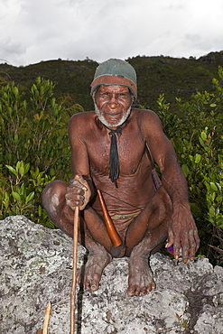 Dani tribesman wearing penis gourd, Baliem Valley, West Papua, Indonesia, Southeast Asia, Asia