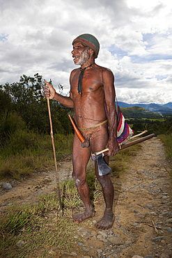 Dani tribesman wearing penis gourd, Baliem Valley, West Papua, Indonesia, Southeast Asia, Asia