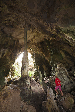 Tourist inside Kotilola Cave, Baliem Valley, West Papua, Indonesia, Southeast Asia, Asia