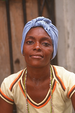 Portrait of a young woman wearing a traditional head scarf, Habana Vieja, Havana, Cuba