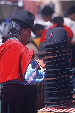 Saquisili south of Quito is one of Latin America's most important indigenous markets woman selling traditional hats, Quito, Ecuador