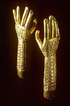 Precolumbian Gold Chimu Culture 1000-1400AD Gold Arms with embossed warrior figures, used in funerary rites collection of Museo del Oro, Lima, Peru