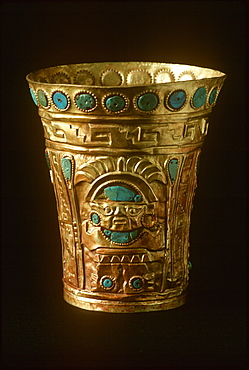 Precolumbian Gold Chimu Culture, 1000-1400AD drinking vessel of gold and turquoise, depicts idol with staff and headdress Museo del Oro, Lima, Peru