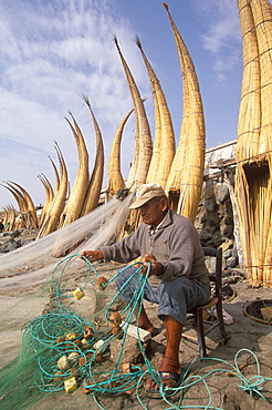 Caballitos de totora', small fishing boats woven of totora reeds in a style unchanged since pre-Inca times at Huanchaco beach, Trujillo, North Coast, Peru