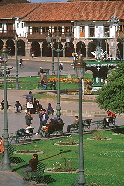 Ancient capital of the Incas the Plaza de Armas in the colonial center of the city with fountain and arcaded buildings beyond, Cuzco, Highlands, Peru