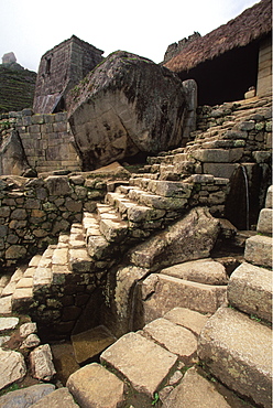 Machu Picchu the Temple of the Sun beyond and a series of fountains in the foreground, Highlands, Peru