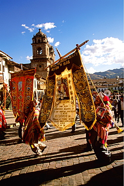 Corpus Christi is one of Peru's most famous festivals with thousands in procession in 's Plaza de Armas carrying banners, Cuzco, Peru