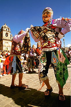 Corpus Christi is one of Peru's most famous festivals, costumed dancers perform the colonial mestizo Cholo in Plaza de Armas, Cuzco, Peru