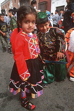 A colonial city on Peru's north coast the Tribute to the Flag Parade on Plaza de Armas children in traditional costumes, Trujillo, Peru