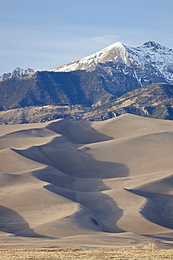 Great Sand Dunes and mountains with snow, Great Sand Dunes National Park and Preserve, Colorado, United States of America, North America