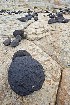 Volcanic boulders on Navajo sandstone, Grand Staircase-Escalante National Monument, Utah, United States of America, North America