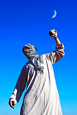 Arab protester throws stone during clashes, Florence, Tuscany, Italy, Europe