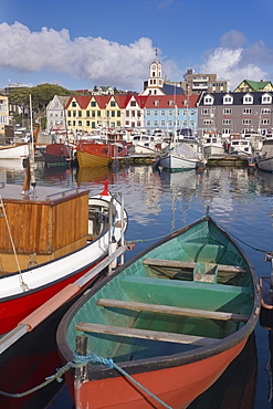 Colourful boats and picturesque gabled buildings along the quayside in Vestaravag harbour, Torshavn, Streymoy, Faroe Islands (Faroes), Denmark, Europe.