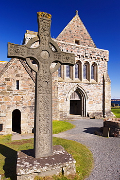 Replica of St. John's cross stands proudly in front of Iona Abbey, Isle of Iona, Scotland, United Kingdom, Europe