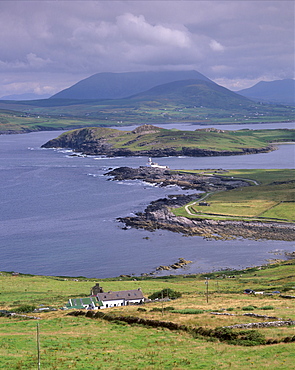 Lighthouse, Beginish Island, Doulus Bay and Knocknadobar in the distance, viewed from Valentia island, Ring of Kerry, County Kerry, Munster, Republic of Ireland, Europe