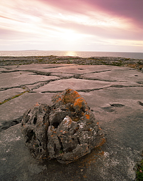 Limestone rocks near the sea at sunset, The Burren, County Clare, Munster, Republic of Ireland (Eire), Europe