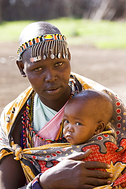 Masai woman and baby, Masai Mara National Reserve, Kenya, East Africa, Africa