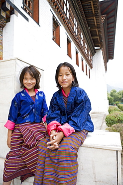 Pilgrims watching religious dances at Buddhist festival (Tsechu), Trashi Chhoe Dzong, Thimphu, Bhutan, Asia