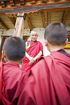 Buddhist lama teaching young monks, Karchu Dratsang Monastery, Bumthang, Bhutan, Asia