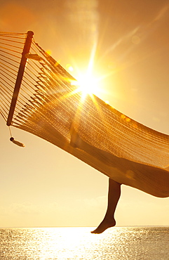 Woman in a hammock on the beach, Florida, United States of America, North America