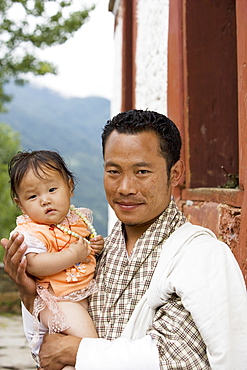 Bhutanese man with daughter, Jankar, Bumthang, Bhutan, Asia