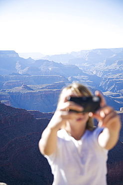 Woman taking pictures, Grand Canyon National Park, UNESCO World Heritage Site, Arizona, United States of America, North America