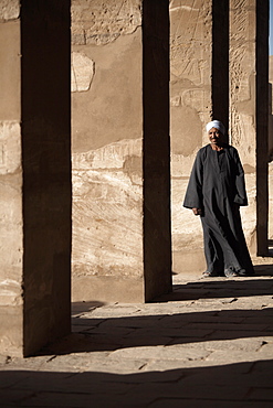 A lone figure stands amongst the Temples of Karnak, Thebes, UNESCO World Heritage Site, Egypt, North Africa, Africa