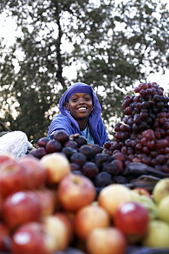 A girl selling fruit in the European Quarter of Djibouti City, Djibouti, Africa