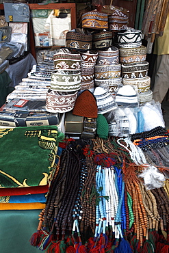 Islamic items including prayer mats and Muslim caps on sale at the market in the European Quarter of Djibouti City, Djibouti, Africa