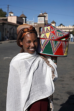 An Eritrean woman with traditional lunch box, Asmara, Eritrea, Africa