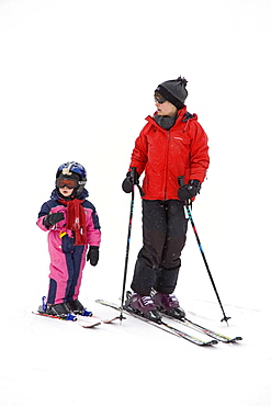 Mother teaching child to ski, Arapahoe Basin Ski Resort, Rocky Mountains, Colorado, United States of America