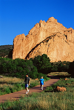 Couple walking, Garden of the Gods Park, Colorado Springs, Colorado, United States of America, North America