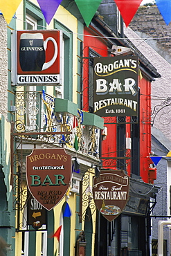 Pub signs, O'Connell Street, Ennis Town, County Clare, Munster, Republic of Ireland, Europe